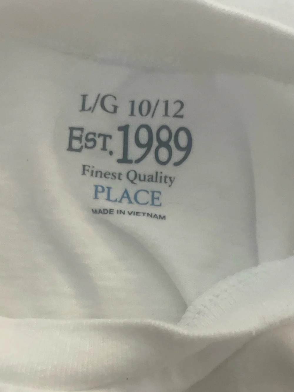 Place White T-Shirt with Red and Black Graphic